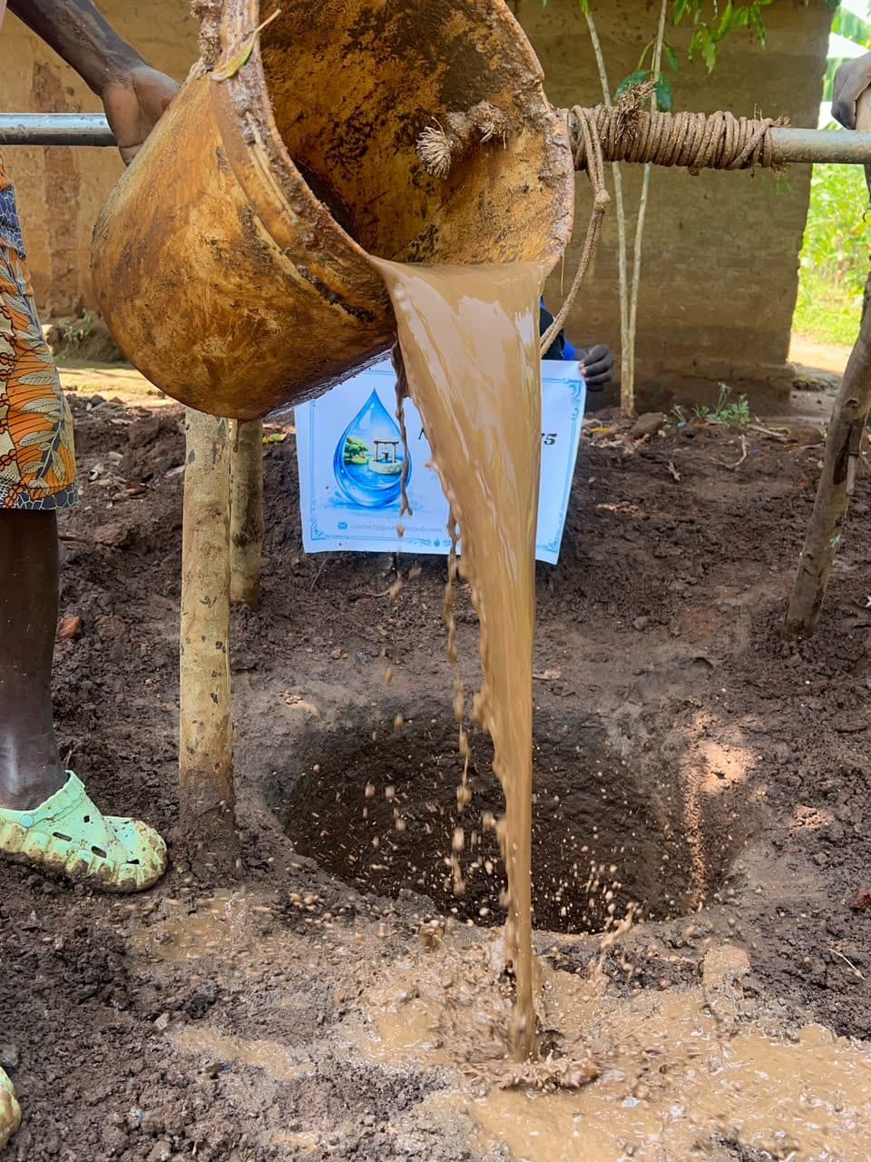 Water drawn up from the borehole, still heavy with soil